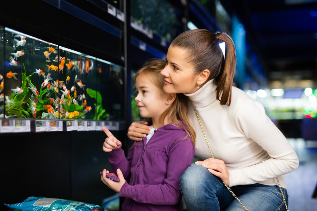 Mother and Child Admiring Aquariums